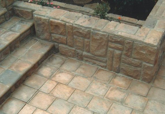 Flagstone steps with natural stone wall cladding